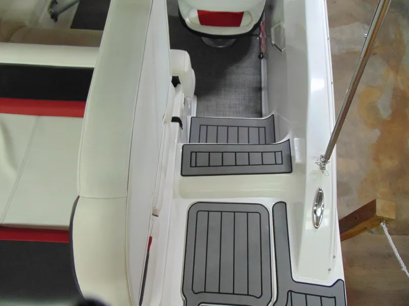 Slide: The Image of 2021 Hurricane SunDeck Sport 188 IO boat interior with gray and red seating, non-slip flooring. - 6