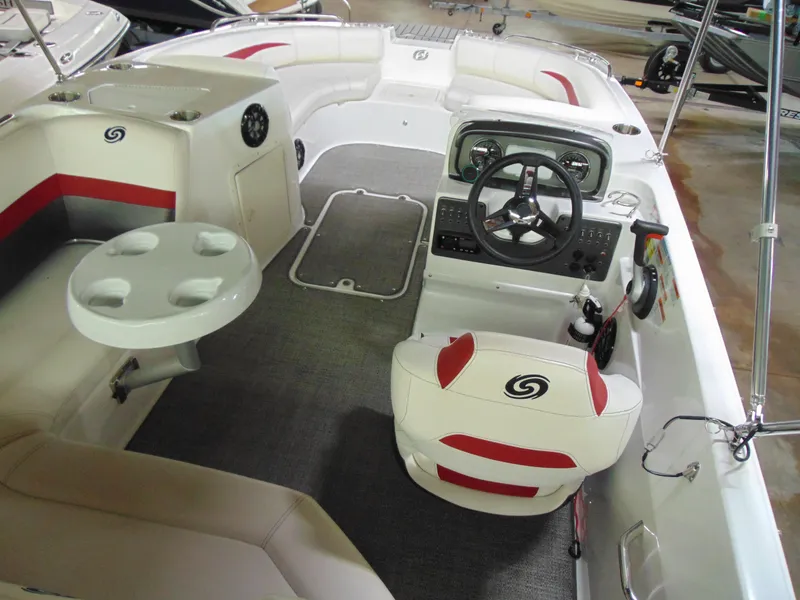 Slide: The Image of 2021 Hurricane SunDeck Sport 188 IO boat interior with steering wheel and seating area. - 7
