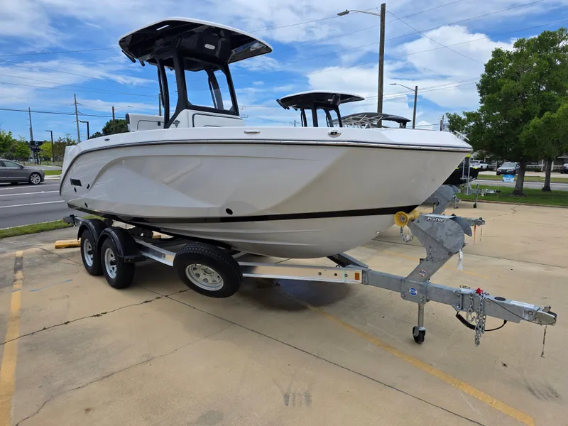 The Image of 2025 Yamaha Boats 222 FSH Sport E on trailer, parked outdoors. - 1