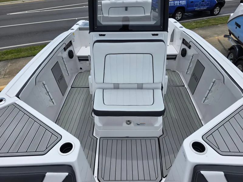 Slide: The Image of 2025 Yamaha Boats 222 FSH Sport E interior with sleek seating and modern design. - 10