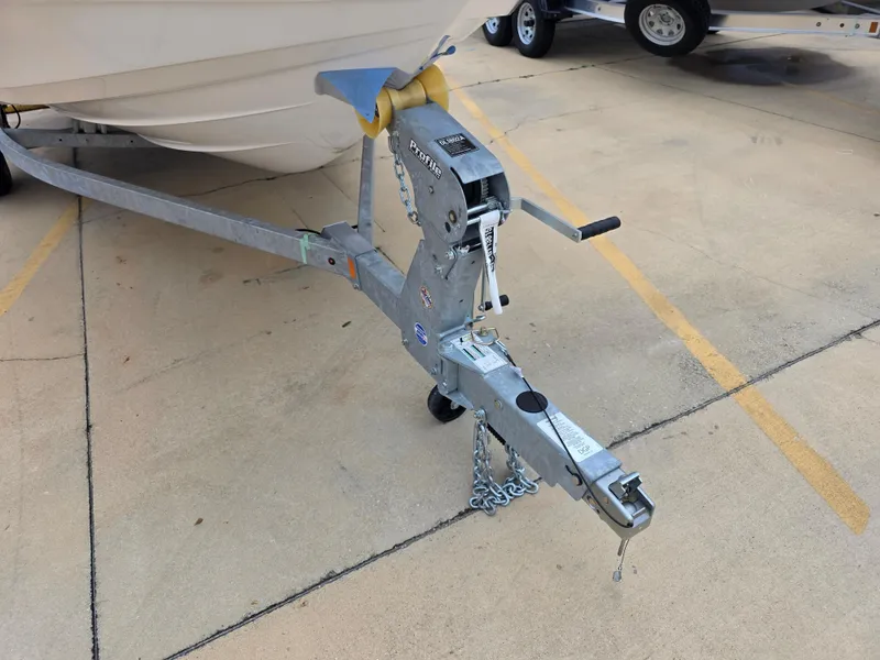 Slide: The Image of Trailer hitch of a 2025 Yamaha Boats 222 FSH Sport E on concrete surface. - 15