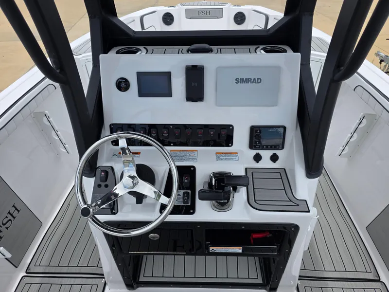 Slide: The Image of 2025 Yamaha Boats 222 FSH Sport E dashboard with steering wheel and controls. - 8
