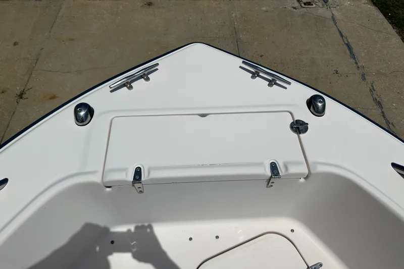 Slide: The Image of Bow of 2005 Grady-White Escape 209 boat with storage compartment and cleats. - 10