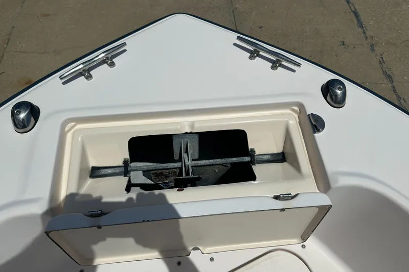 Slide: The Image of 2005 Grady-White Escape 209 boat anchor compartment, open and empty. - 11