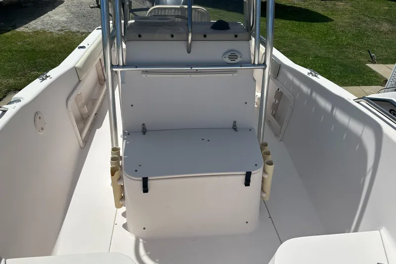 Slide: The Image of 2005 Grady-White Escape 209 boat interior with seating and rod holders. - 12