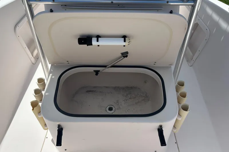 Slide: The Image of Livewell on 2005 Grady-White Escape 209 boat, featuring rod holders and storage. - 15