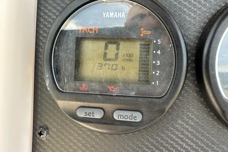 Slide: The Image of Yamaha tachometer displaying 370 hours on a 2005 Grady-White Escape 209 boat. - 22
