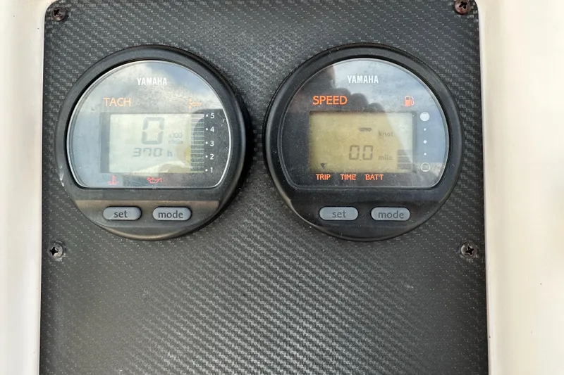 Slide: The Image of Yamaha tachometer and speedometer on 2005 Grady-White Escape 209 boat dashboard. - 23