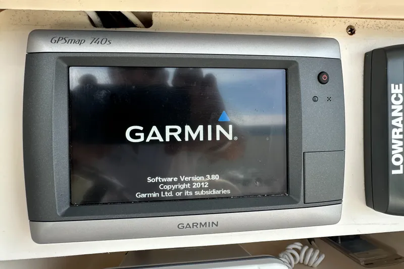 Slide: The Image of Garmin GPSmap 740s on 2005 Grady-White Escape 209 boat dashboard. - 24