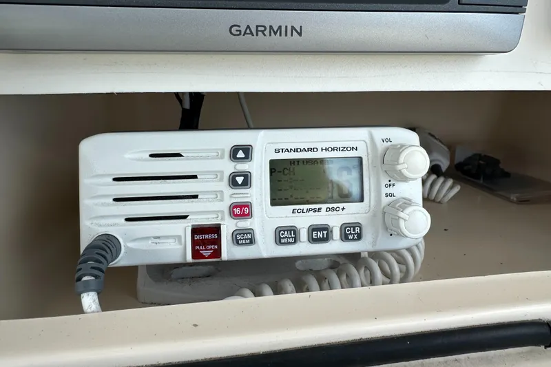 Slide: The Image of Marine radio on 2005 Grady-White Escape 209 boat, featuring Standard Horizon Eclipse DSC+. - 25