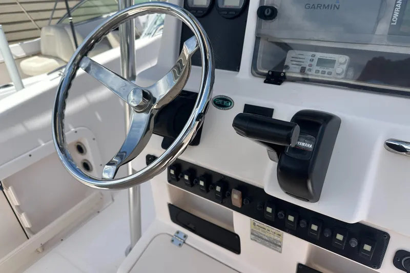 Slide: The Image of Steering console of 2005 Grady-White Escape 209 boat with Yamaha controls. - 29