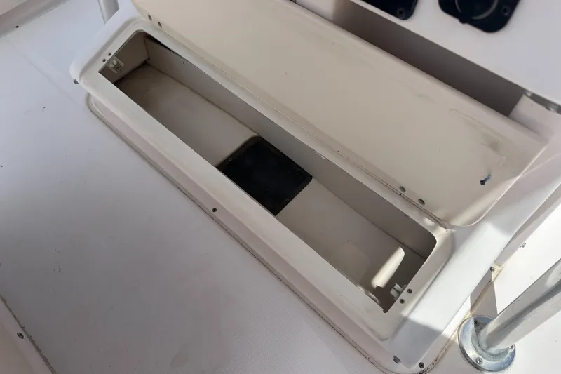 Slide: The Image of Open storage compartment on a 2005 Grady-White Escape 209 boat. - 31