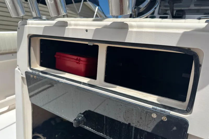 Slide: The Image of 2005 Grady-White Escape 209 boat storage compartment with red box inside. - 38