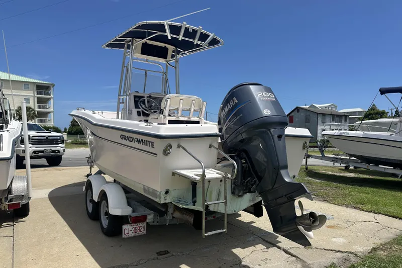 Slide: The Image of 2005 Grady-White Escape 209 boat with Yamaha 200 engine on trailer, parked outdoors. - 4