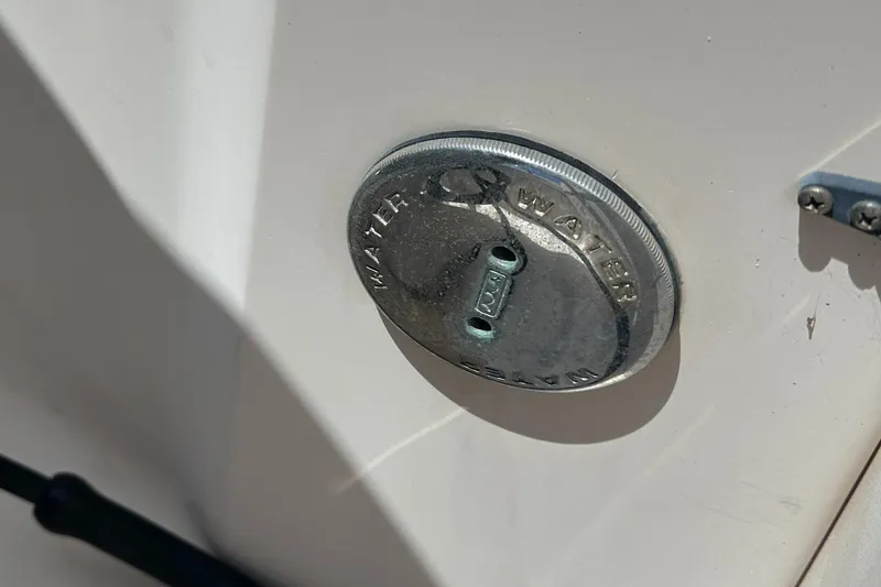 Slide: The Image of Close-up of a 2005 Grady-White Escape 209 water fill cap. - 40