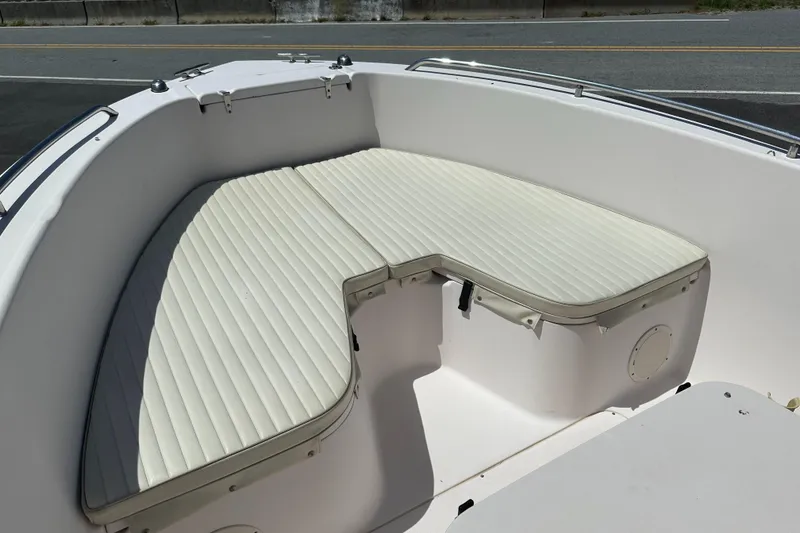 Slide: The Image of 2005 Grady-White Escape 209 boat with cushioned seating in the bow area. - 7