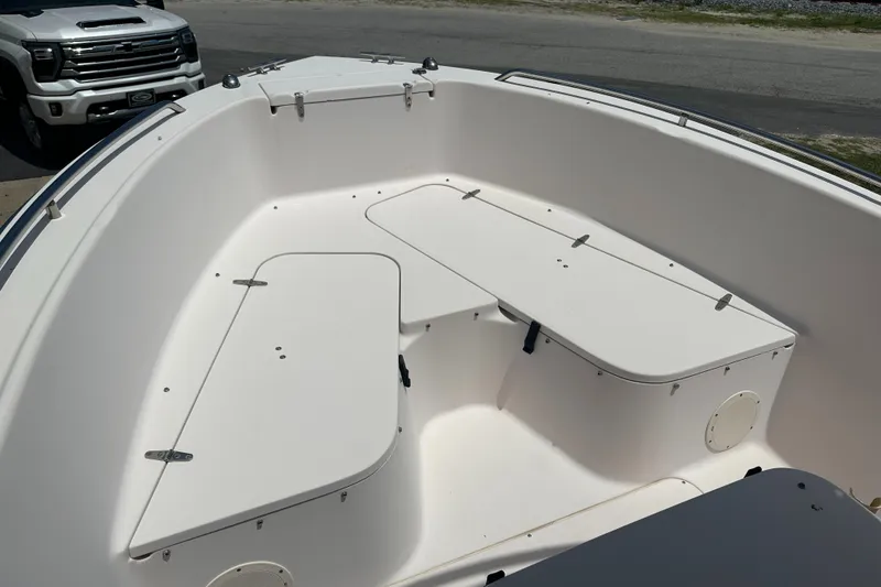 Slide: The Image of 2005 Grady-White Escape 209 boat interior with seating and storage compartments. - 8