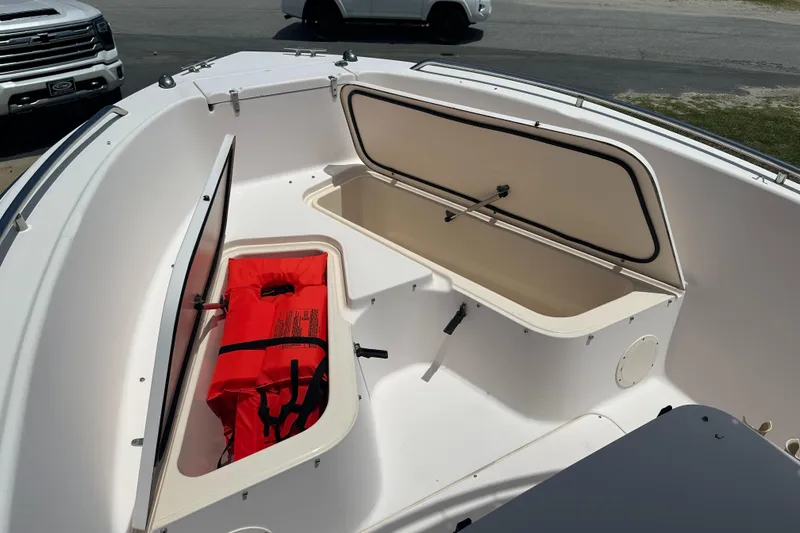 Slide: The Image of 2005 Grady-White Escape 209 boat storage compartments with life jacket. - 9