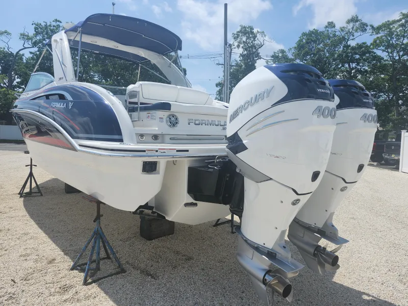 Slide: The Image of 2020 Formula 310 Sun Sport boat with dual Mercury 400 engines on display. - 11