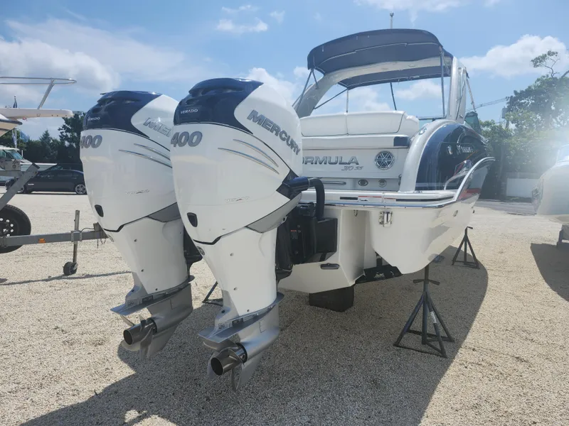 Slide: The Image of 2020 Formula 310 Sun Sport boat with twin Mercury 400 engines on display. - 12