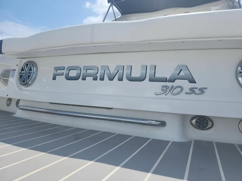 Slide: The Image of 2020 Formula 310 Sun Sport boat rear view with logo and details. - 14