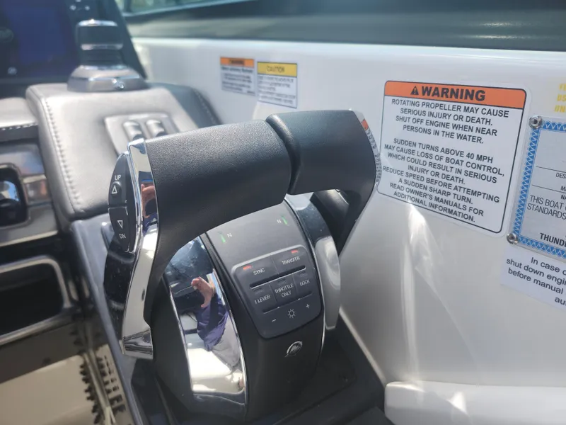 Slide: The Image of Throttle control and warning labels on 2020 Formula 310 Sun Sport boat dashboard. - 17