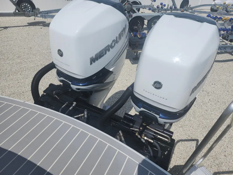 Slide: The Image of Twin Mercury outboard engines on a 2020 Formula 310 Sun Sport boat. - 22