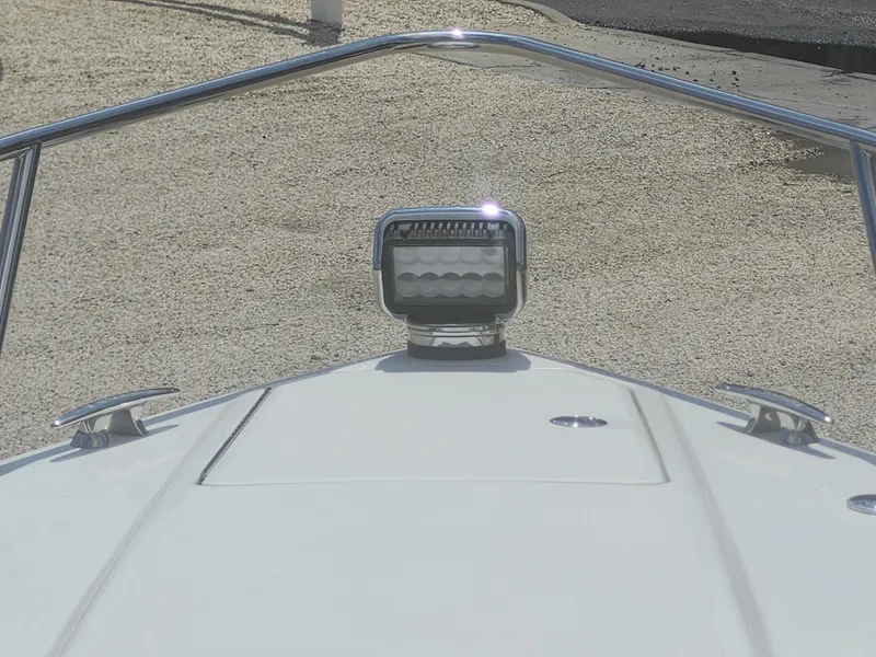 Slide: The Image of Bow view of 2020 Formula 310 Sun Sport boat with spotlight and chrome railings. - 25