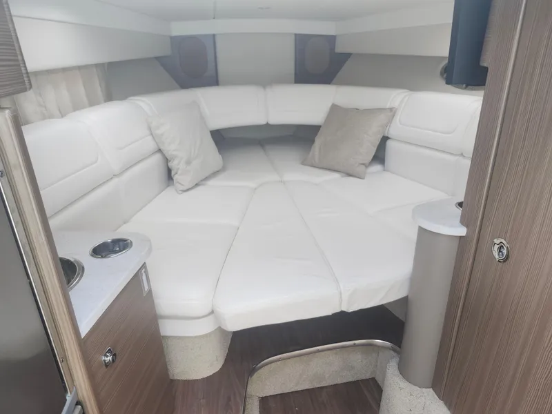 Slide: The Image of 2020 Formula 310 Sun Sport cabin with white leather seating and modern interior design. - 27