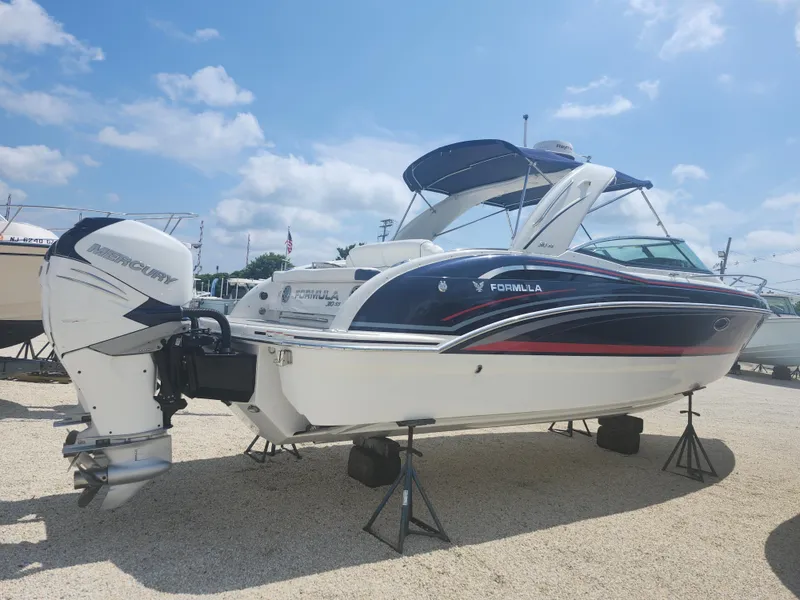 Slide: The Image of 2020 Formula 310 Sun Sport boat with Mercury outboard, displayed outdoors on a sunny day. - 3