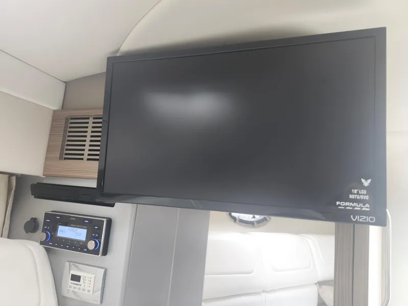 Slide: The Image of 2020 Formula 310 Sun Sport interior with Vizio TV and control panel. - 30