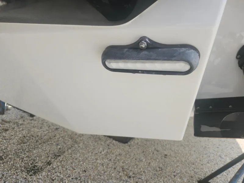 Slide: The Image of Close-up of 2020 Formula 310 Sun Sport boat hull detail with light fixture. - 34