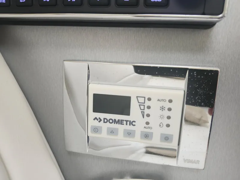 Slide: The Image of Dometic control panel on 2020 Formula 310 Sun Sport boat, featuring temperature settings. - 35