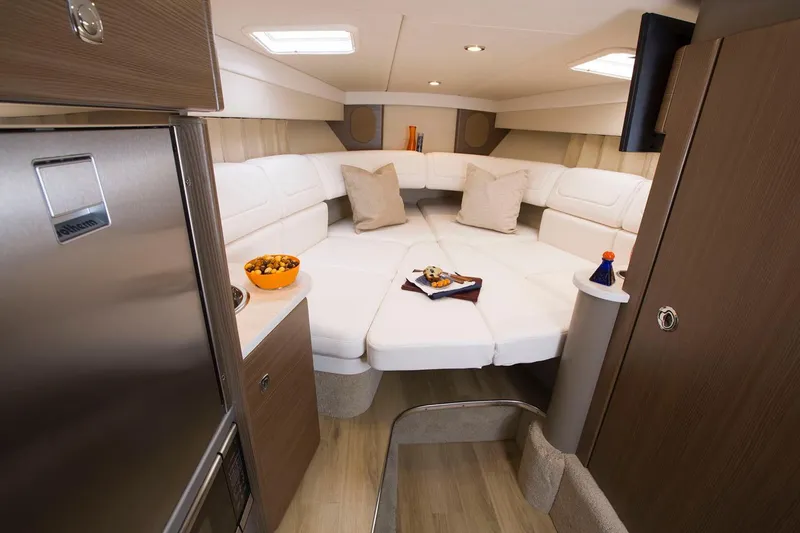 Slide: The Image of Manufacturer Provided Image: Interior of 2020 Formula 310 Sun Sport boat with white seating and modern amenities. - 39