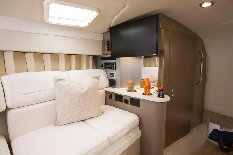 Slide: The Image of Manufacturer Provided Image: Interior of 2020 Formula 310 Sun Sport boat with white seating and entertainment area. - 40