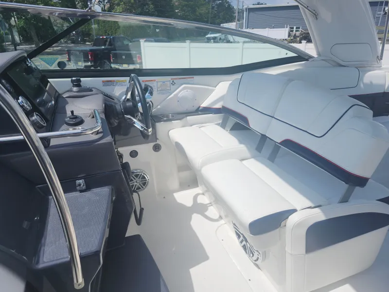 Slide: The Image of 2020 Formula 310 Sun Sport boat interior with white seating and modern dashboard. - 5