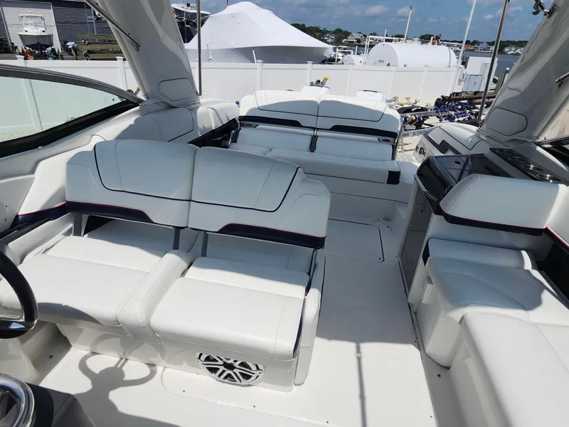 Slide: The Image of 2020 Formula 310 Sun Sport boat interior with white seating and modern design. - 6