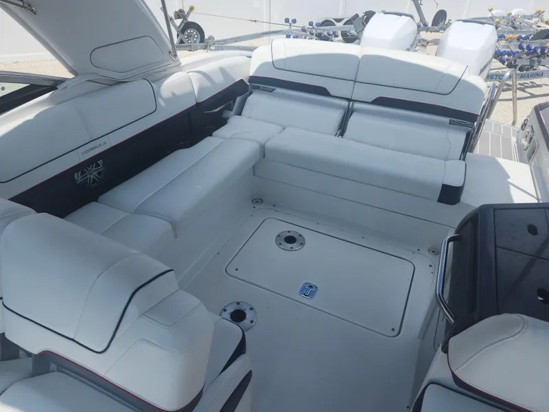 Slide: The Image of 2020 Formula 310 Sun Sport boat interior with white seating and modern design. - 7