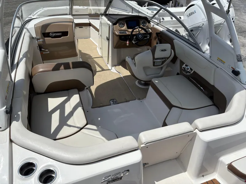 Slide: The Image of 2016 Chaparral 230 Suncoast boat interior with seating and steering console. - 20