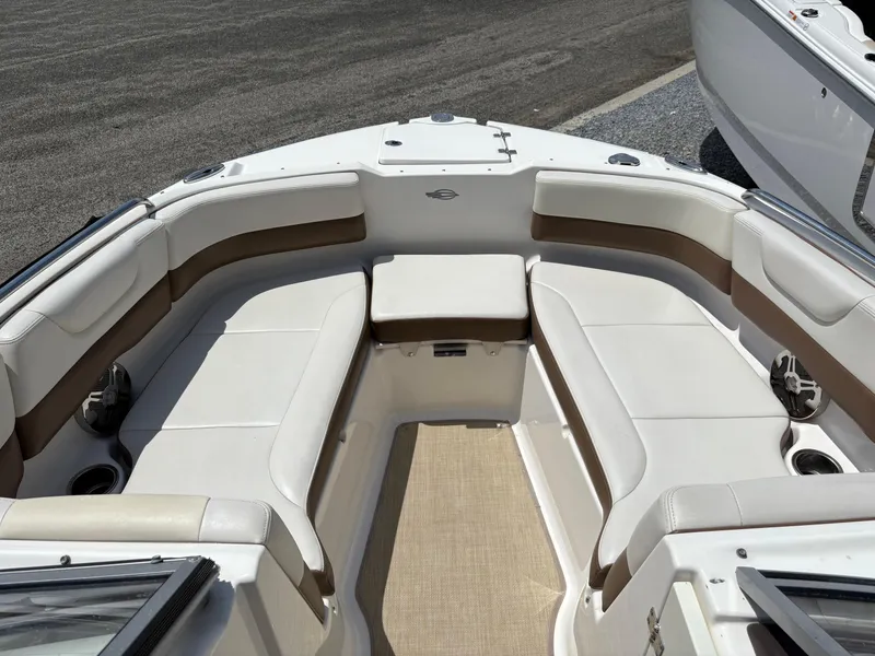 Slide: The Image of 2016 Chaparral 230 Suncoast boat interior with white and brown seating. - 34