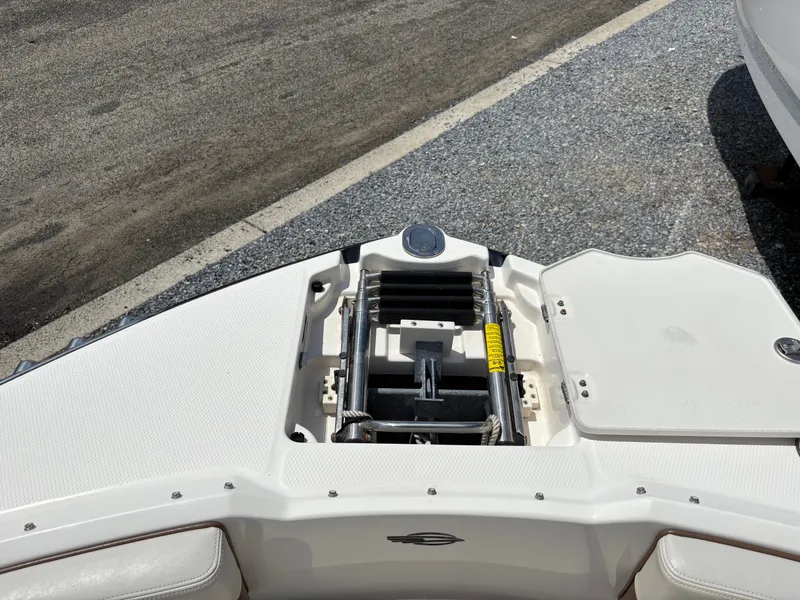Slide: The Image of Bow of 2016 Chaparral 230 Suncoast with anchor storage and ladder. - 37