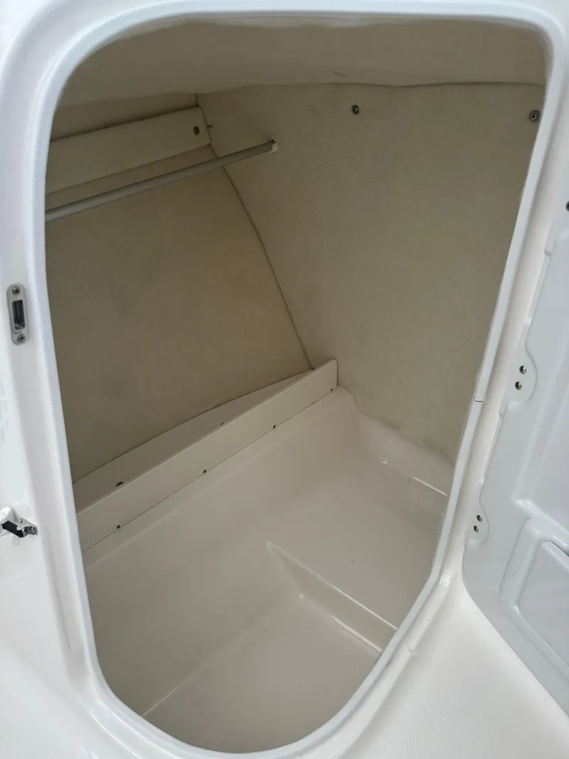 Slide: The Image of 2025 Robalo R207 Dual Console storage compartment, spacious and clean interior design. - 19