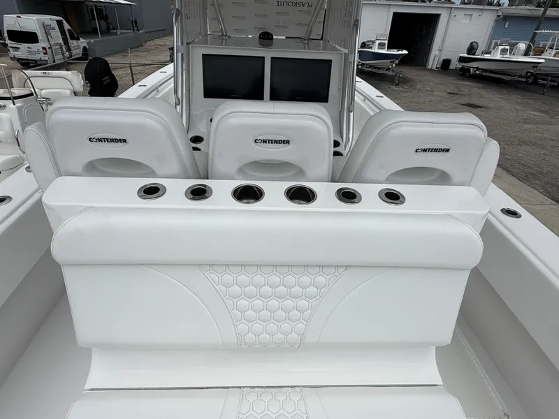 Slide: The Image of 2026 Contender 39 ST boat interior with white seating and cup holders. - 10