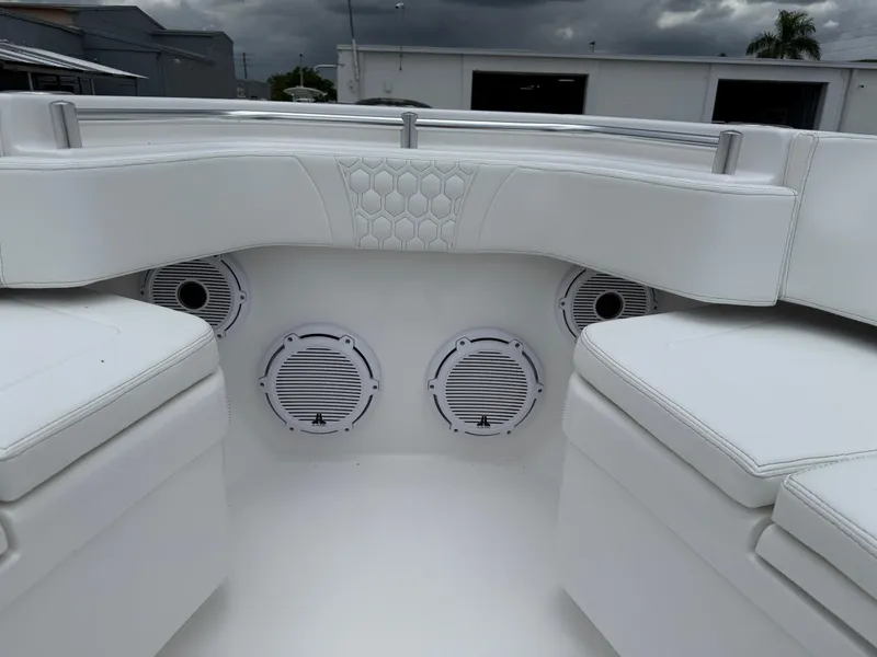 Slide: The Image of 2026 Contender 39 ST boat interior with white seating and built-in speakers. - 12