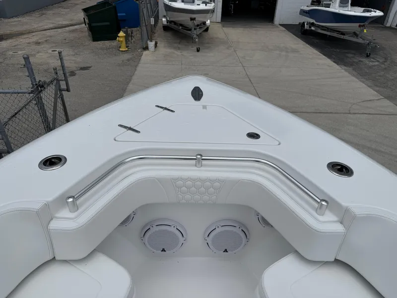 Slide: The Image of 2026 Contender 39 ST boat interior with white seating and stainless steel railings. - 13