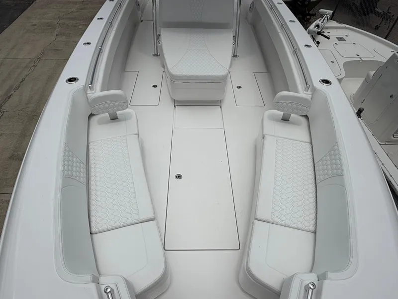 Slide: The Image of 2026 Contender 39 ST boat interior with white cushioned seating and sleek design. - 14