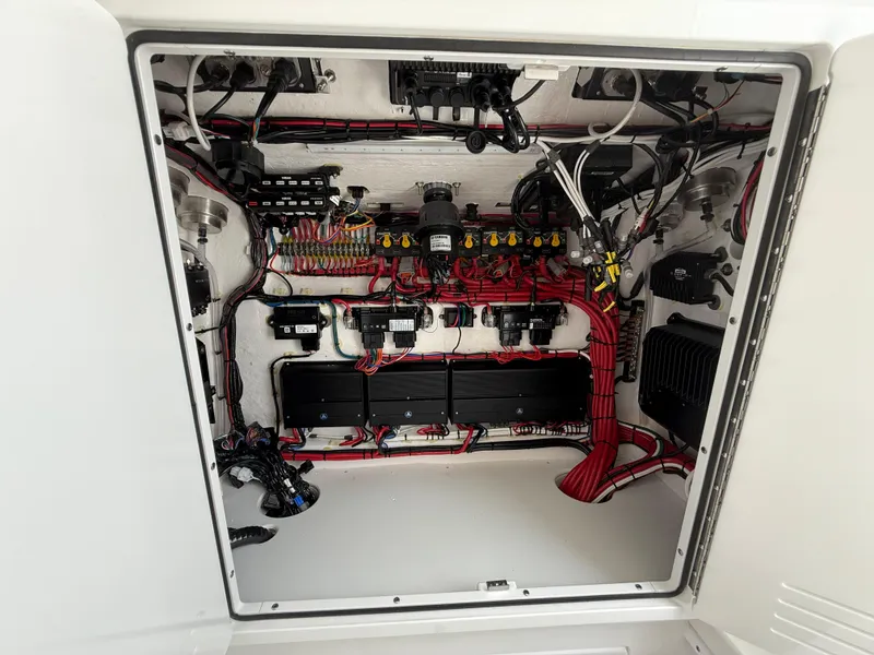 Slide: The Image of Electrical compartment of 2026 Contender 39 ST boat, showcasing organized wiring and components. - 19