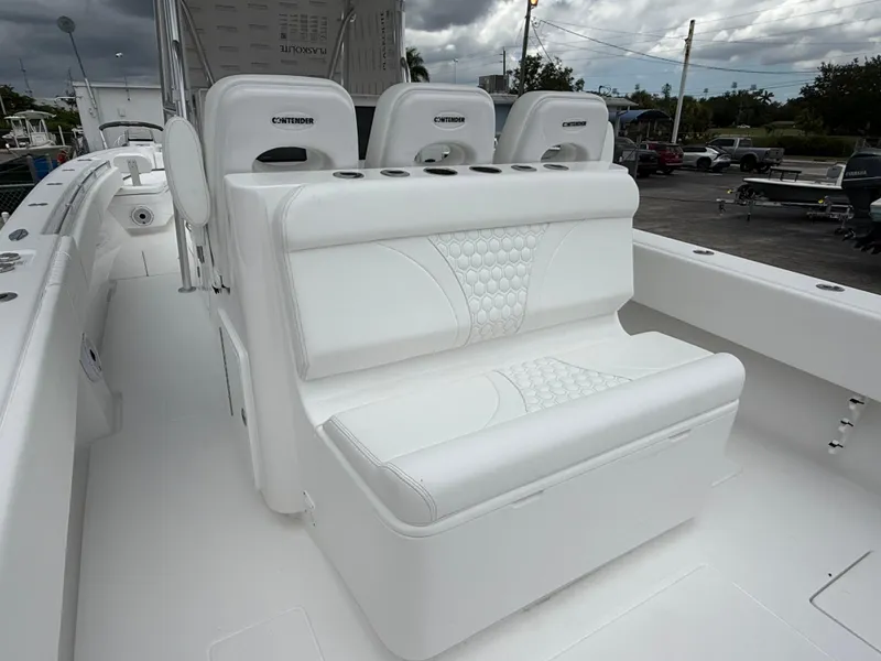 Slide: The Image of 2026 Contender 39 ST boat interior with white seating and cup holders. - 8