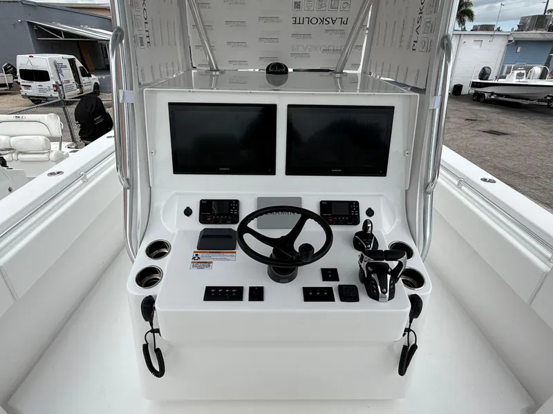 Slide: The Image of 2026 Contender 39 ST boat console with dual screens and steering wheel. - 9