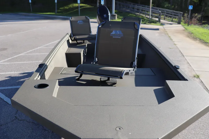 Slide: The Image of 2025 Thor 1754 Lake Hammer Tiller boat with seating, parked in a lot. - 2